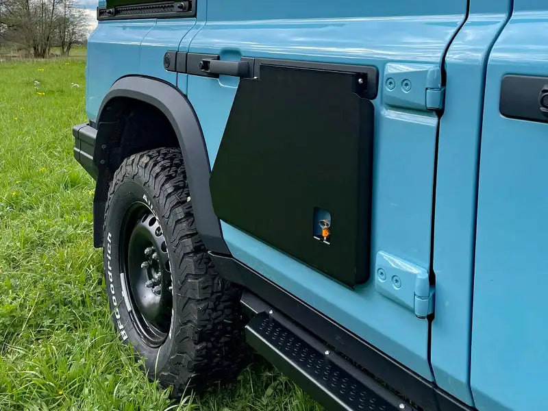 Table that attaches to vehicle door and folds down